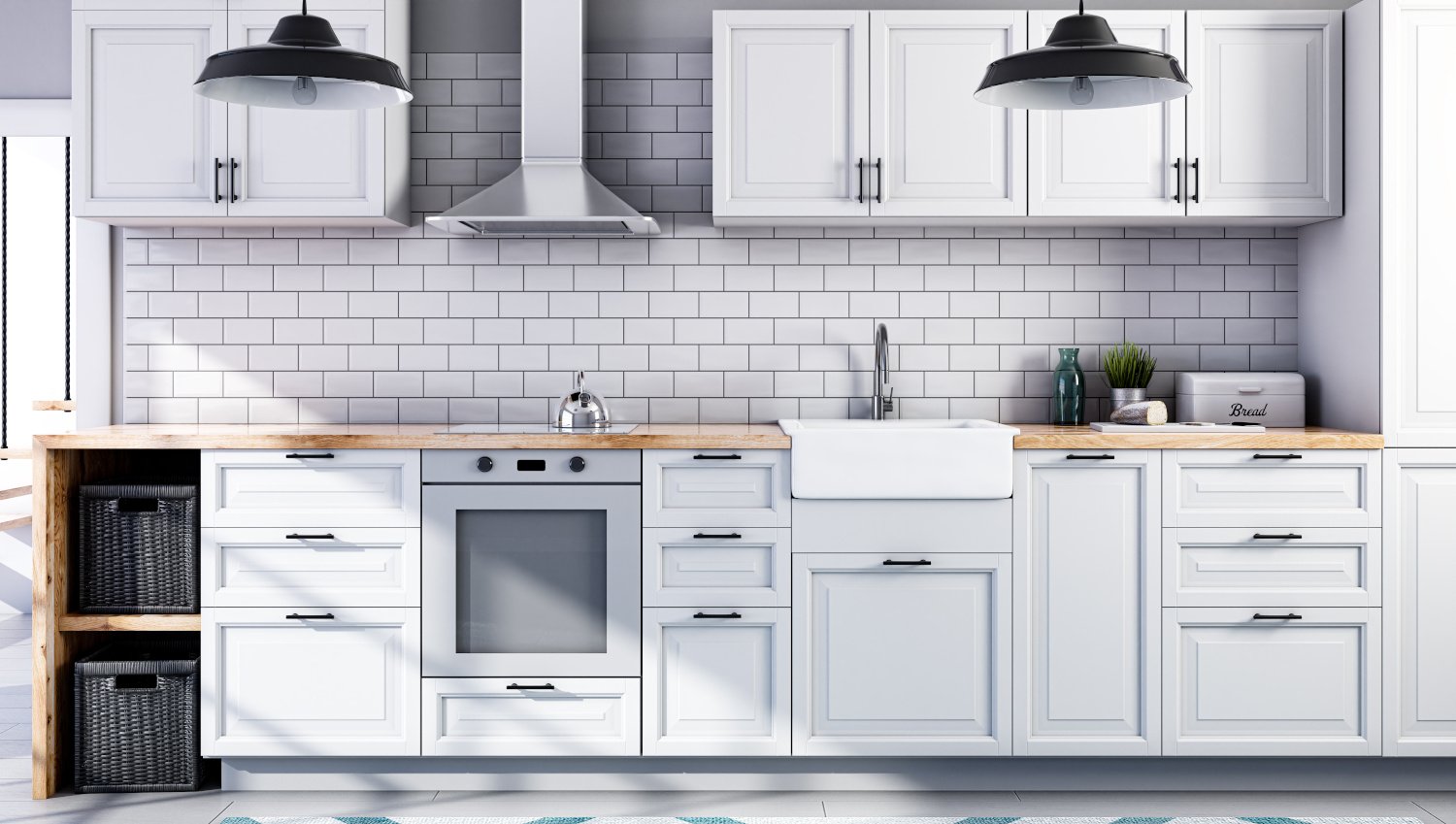 One-wall kitchen in a loft with white cabinets, white subway tile backsplash and wood countertops